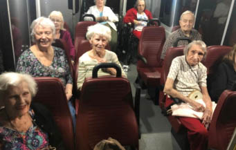 cabot cove of largo seniors on tour bus watching Christmas lights