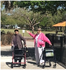 Assisted Living Community Cabot Cove of Largo residents walking outdoors