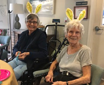 residents Barbara and Lois with bunny ears