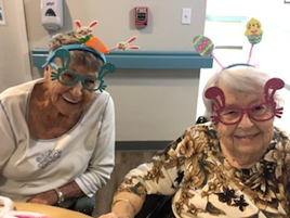 Assisted Living residents Micki and Edna with bunny ears