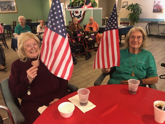 cabot cove of largo residents celebrating waving flags