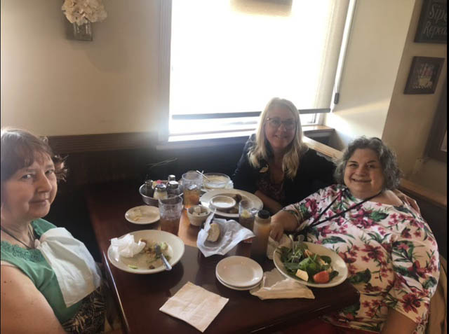assisted living residents enjoying their luncheon among friends