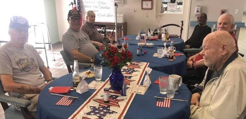 assisted living residents celebrating Veterans Day