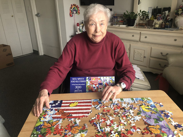 assisted living resident enjoying puzzle time