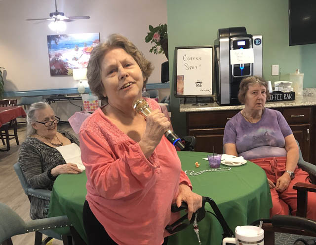 assisted living resident singing at Cabot Cove of Largo