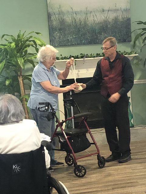 assisted living entertainment with magician